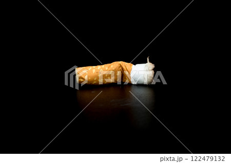 Cigarette butts isolated on black background Cigarette butts isolated on black background 122479132