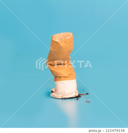 Cigarette butts isolated on blue background Cigarette butts isolated on blue background 122479156