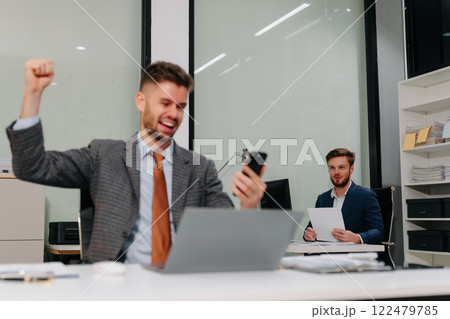 Smiling confident mature businessman creative are excited business success. Smiling confident mature businessman creative are excited business success. 122479785