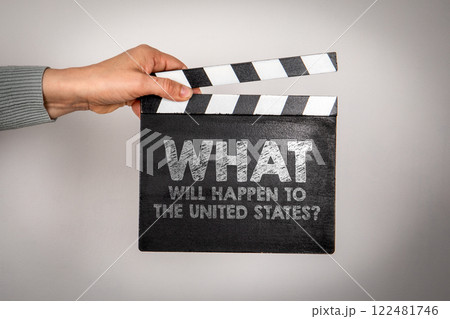 What will happen to the United States. Female hands holding movie clapper What will happen to the United States. Female hands holding movie clapper 122481746