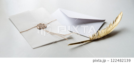 Golden pen and stamped envelope Golden pen and stamped envelope 122482139