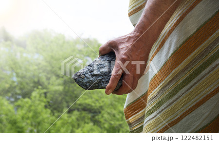 Male hand with big stone 122482151