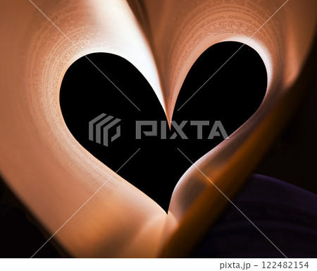 Book pages folded in the shape of a heart 122482154