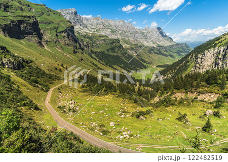 Mountain landscape and pass road at Klausen Pass in the Swiss Alps, Canton of Uri, Switzerland Mountain landscape and pass road at Klausen Pass in the Swiss Alps, Canton of Uri, Switzerland 122482519