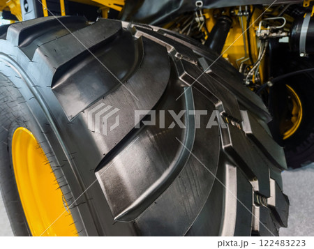 Large agricultural tire showcasing advanced tread design and robust construction for efficient field performance 122483223