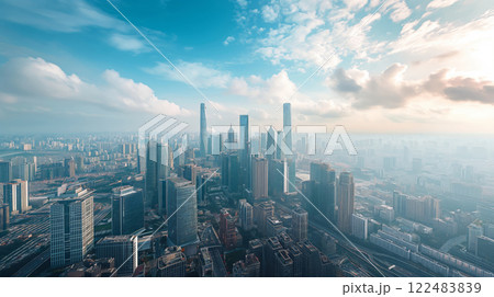 Breathtaking aerial shot of a modern cityscape bathed in the warm glow of sunrise 122483839