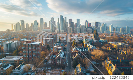 Stunning aerial view of a vibrant cityscape as the sun sets, lighting up the skyscrapers and streets 122483843