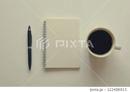 Minimalistic Composition of Blank Notepad, Pen and Coffee Cup on Neutral Background 122486913