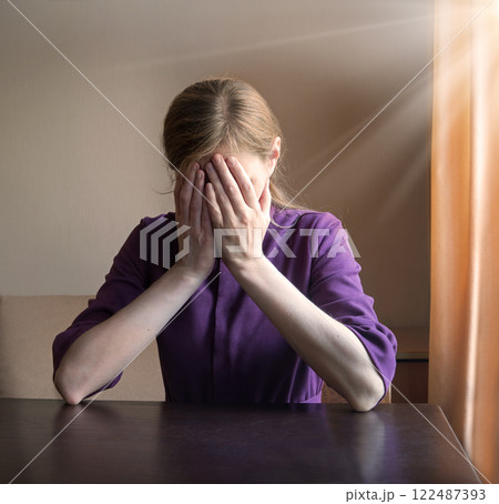 Sad girl praying to God Sad girl praying to God 122487393