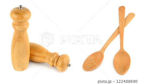 Pepper grinder mills and Wooden spoons isolated on white. Free space for text. Wide photo. Collage. 122488690