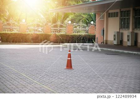 Red and white traffic cones placed on the ground Red and white traffic cones placed on the ground 122489934