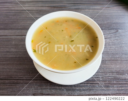 White bowl with Krupnik Polish soup. White bowl with Krupnik Polish soup. 122490222