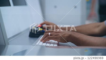 Close Up of Security Officer Controlling Luggage or Passenger Scanning Using Modern Equipment 122490369