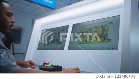 Security Officer Finds Suspicious Item in Suitcase during X-ray Screening, Transmits Information by Walkie-Talkie Security Officer Finds Suspicious Item in Suitcase during X-ray Screening, Transmits Information by Walkie-Talkie 122490479