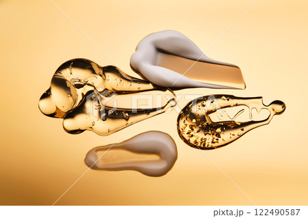 Textures of different cosmetic products on a gold background. 122490587