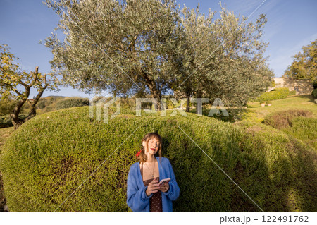 Woman Relaxing in Olive Garden 122491762