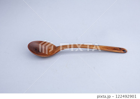 Wooden kitchen utensils stacked view close up Wooden kitchen utensils stacked view close up 122492901
