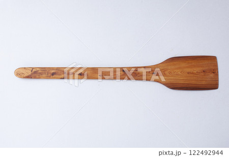Wooden kitchen utensils stacked view, spoon and spatula close up Wooden kitchen utensils stacked view, spoon and spatula close up 122492944