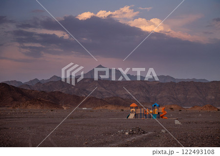 Playground in a Barren Desert Surreal Landscape at Dusk 122493108
