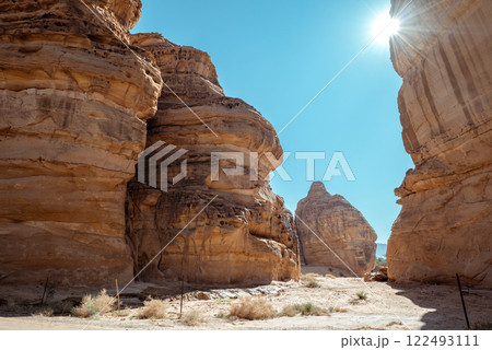 Majestic Sandstone Canyons of AlUla Sunlit Desert Passage in Saudi Arabia 122493111
