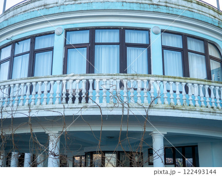Balcony in a semicircle. Building's facade. 122493144