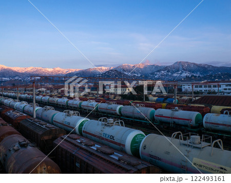 Tanks with fuel in the parking lot of the station. Railway moving. A lot of railway wagons with fuel. Texol. Oil transit on trains. Tanks with fuel in the parking lot of the station. Railway moving. A lot of railway wagons with fuel. Texol. Oil transit on trains. 122493161