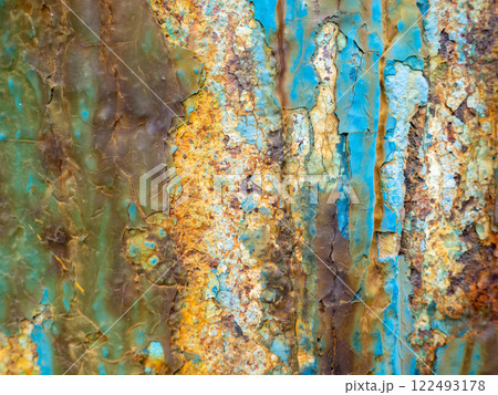 Rust on a blue surface. Cracks in the paint. Old iron. Rusty metal. 122493178