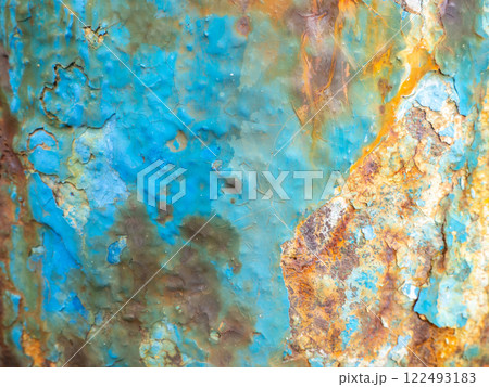 Rust on a blue surface. Cracks in the paint. Old iron. Rusty metal. 122493183