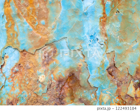 Rust on a blue surface. Cracks in the paint. Old iron. Rusty stains on metal. Rust on a blue surface. Cracks in the paint. Old iron. Rusty stains on metal. 122493184