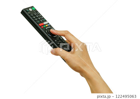 Asian woman use finger of left hand to press button on television remote control isolated on white background with clipping path. Asian woman use finger of left hand to press button on television remote control isolated on white background with clipping path. 122495063