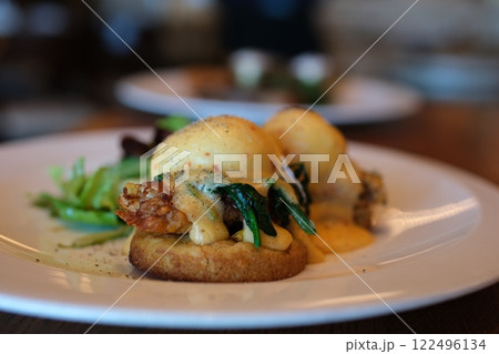 BENEDICTS AVOCAD0 asparagus lime hollandaise restaurant chic serving eggs benedict 122496134