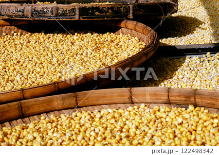 Close up of corn seeds in a basket on a market stall. 122498342