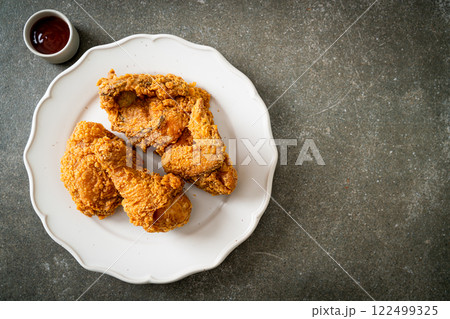 fried chicken with ketchup on plate fried chicken with ketchup on plate 122499325