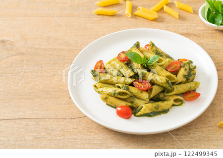 penne pasta with pesto sauce and tomatoes penne pasta with pesto sauce and tomatoes 122499345