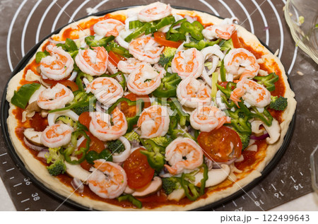 Preparing seafood homemade pizza. close up. 122499643