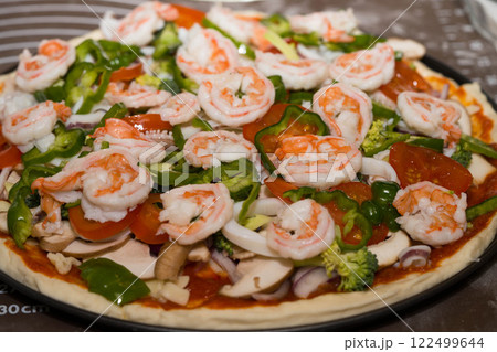 Preparing seafood homemade pizza. close up. 122499644