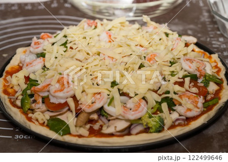 Preparing seafood homemade pizza. close up. 122499646