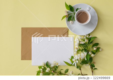 Vibrant colored paper and coffee beside fresh flowers create a serene workspace atmosphere during a creative session Vibrant colored paper and coffee beside fresh flowers create a serene workspace atmosphere during a creative session 122499669