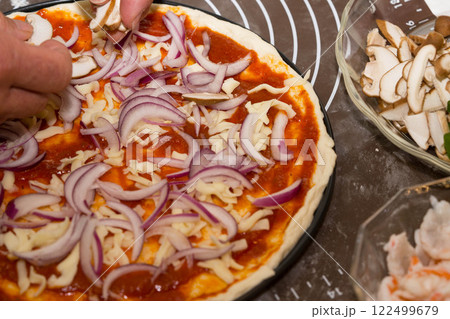 Preparing seafood homemade pizza. close up. Preparing seafood homemade pizza. close up. 122499679