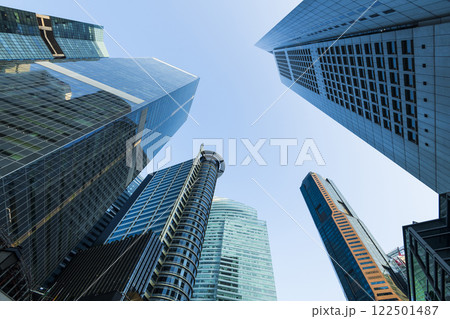 Low-angle building view of the modern office skyscrapers in the financial district of Raffles Place, Singapore. 122501487