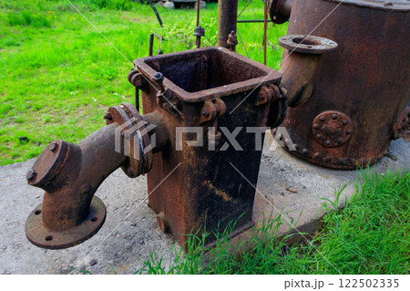 Old steaming threshing machine in Open air Museum of Folk Architecture and Folkways of Middle Naddnipryanschina in Pereyaslav, Ukraine 122502335