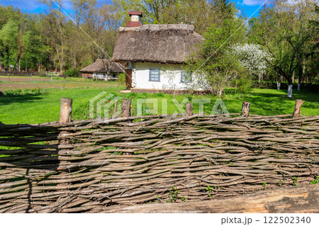 Ancient traditional ukrainian rural house  in Open air Museum of Folk Architecture and Folkways of Middle Naddnipryanschina in Pereyaslav, Ukraine 122502340