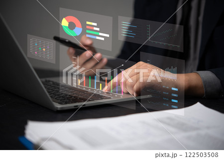 Businessman using laptop computer data analysis and financial growth graph chart marketing report. Business planning, strategy and development digital assets. accounting research business concept 122503508