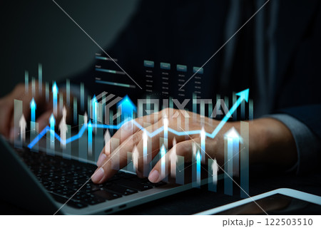 Businessman using computer to analysis data with graph and research financial marketing and business growth target plan Businessman using computer to analysis data with graph and research financial marketing and business growth target plan 122503510