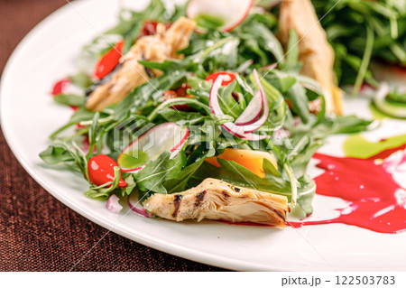 Portion of gourmet fresh salad with artichokes Portion of gourmet fresh salad with artichokes 122503783