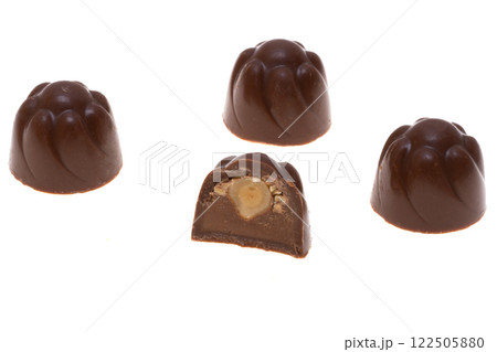 chocolate candies with hazelnuts isolated 122505880