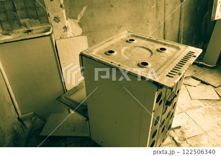 Kitchen of abandoned apartment in the ghost town Pripyat in Chernobyl Exclusion Zone, Ukraine. Black and white tone 122506340