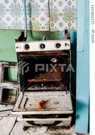 Kitchen of abandoned apartment in the ghost town Pripyat in Chernobyl Exclusion Zone, Ukraine 122506341