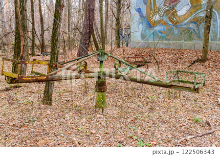 Abandoned children's playground in the ghost town Pripyat in Chernobyl Exclusion Zone, Ukraine Abandoned children's playground in the ghost town Pripyat in Chernobyl Exclusion Zone, Ukraine 122506343