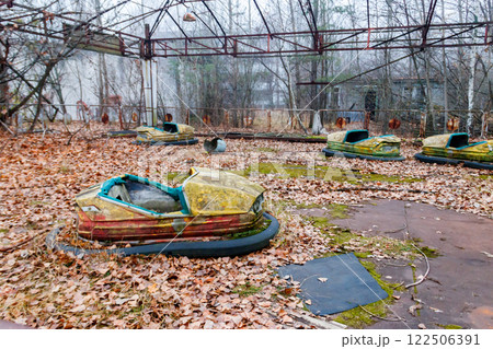 Abandoned bumper cars in the amusement park of Pripyat city in Chernobyl Exclusion Zone, Ukraine 122506391
